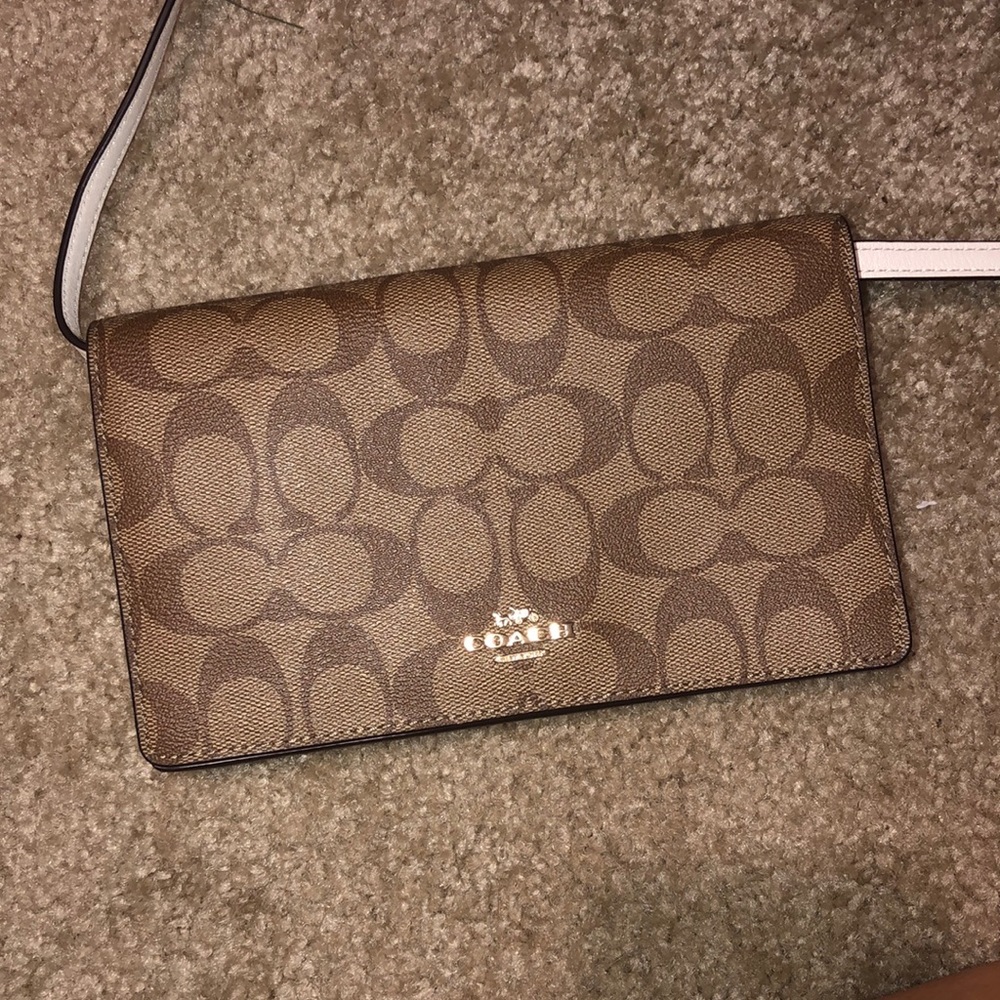 Brand new coach 2-in-1, wallet with removal strap.
